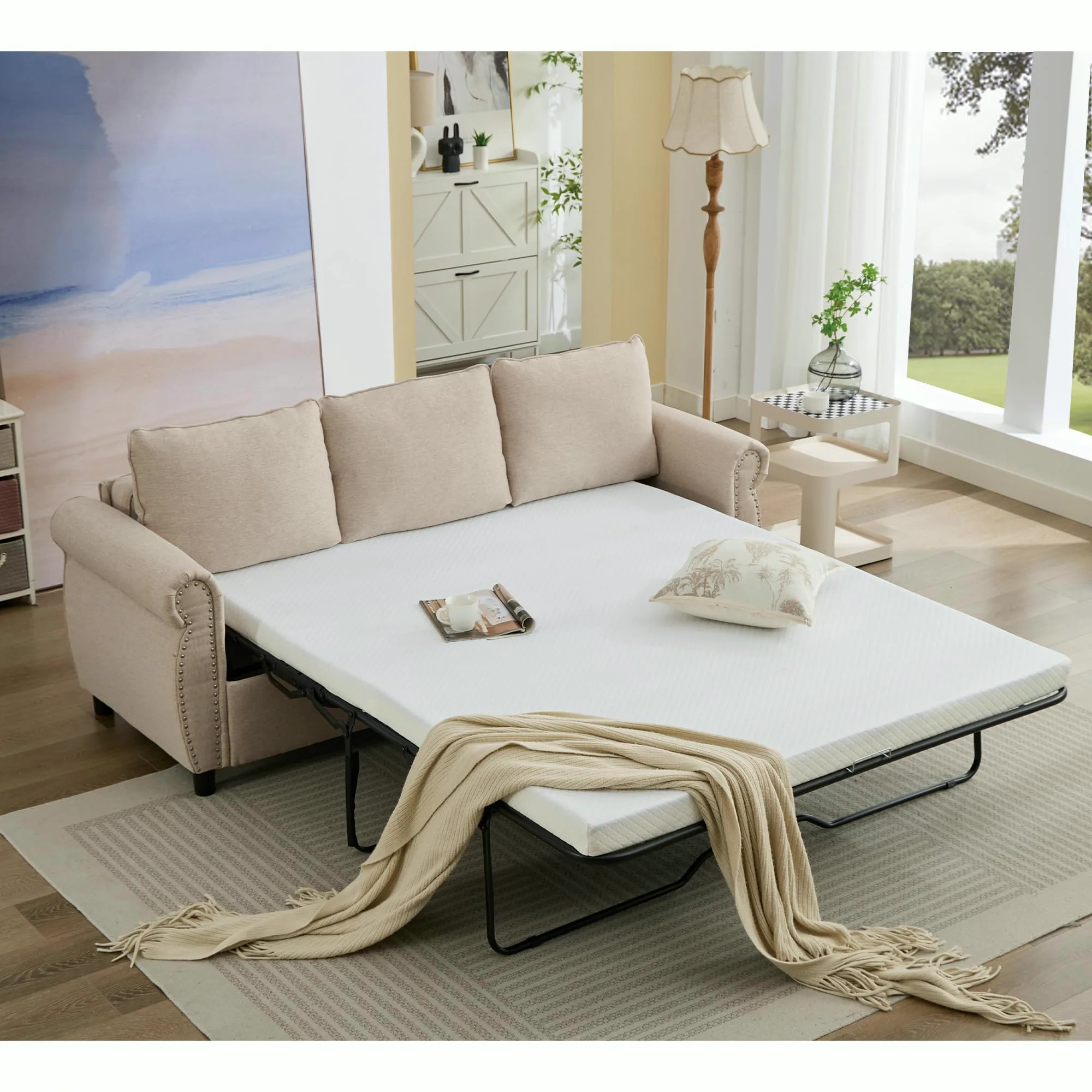 Beige sleeper sofa with the pull-out bed and mattress open in a living room